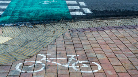 Bicycle path passing through the pedestrian crossing. Road Bike detail. Pedestrian crossing with...