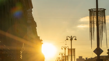Panoramic view of silhouettes of buildings and street lights at sunset in the historical center of...