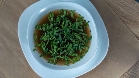 Close-up view of mushroom soup with green onions and champignons. Healthy food concepts. Tasty...