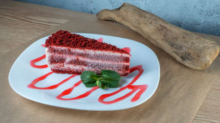 Fresh strawberry cheesecake with mint leaf on white plate. fresh strawberry cake from above. Pastry...