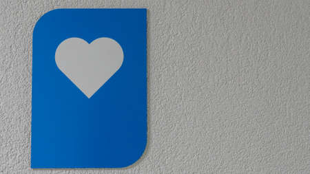 A blue plaque with a silhouette of a heart. health care concepts. Space for text. medical textured.