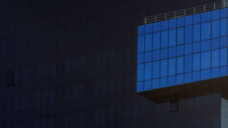 Part of a modern dark glass building. Space for text. Business concept of future architecture. blue gradient line.の写真素材