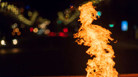 Eternal flame in memory of the fallen wars in the great Patriotic war at night. Defocused background. Night view of the war memorial. selective focus.の写真素材