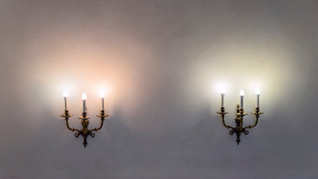 Vintage wall lamp. Space for text. Lamp light on the wall. Working lamps at dusk. Object background.