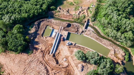 Aerial view of construction of the river drains. Construction drains to prevent flooding in the city. Drain water into the river. urban concepts.の写真素材