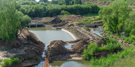 Construction of the river drains. Construction drains to prevent flooding in the city. Drain water into the river. urban concepts.の写真素材