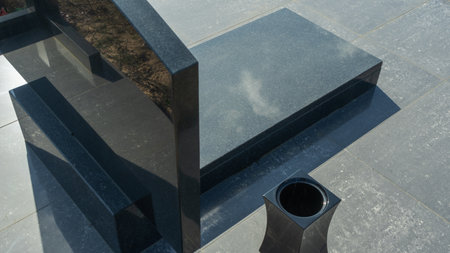 Gravestones at a quiet cemetery honor the memory of loved ones, symbolizing faith, resurrection, and eternal life. A solemn place blending spirituality, tradition, and reflection.の写真素材