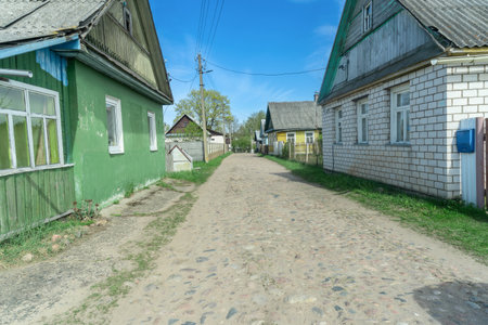 Charming old village road lined with cobblestones, showcasing rustic beauty and historical charm. A picturesque path inviting exploration and evoking nostalgia.の写真素材