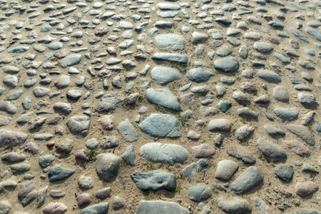 Charming old village road lined with cobblestones, showcasing rustic beauty and historical charm. A picturesque path inviting exploration and evoking nostalgia.の写真素材