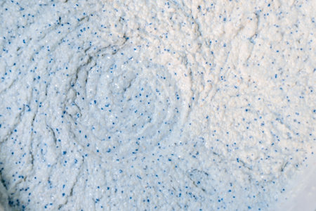 Production of decorative plaster at the factory. Materials for repair and decoration. Closeup of...