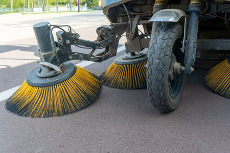 Innovative electric street sweeper efficiently cleaning pedestrian walkways and bike paths for a...