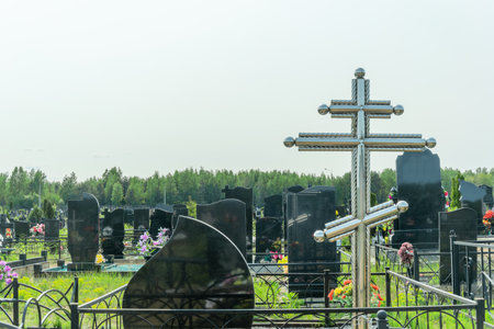 Serene cemetery landscape in summer. Timeless monuments standing guard over cherished memories in a...