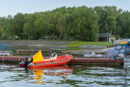 Inflatable rescue boat equipped with steering console. Safe haven for exploration a red inflatable...