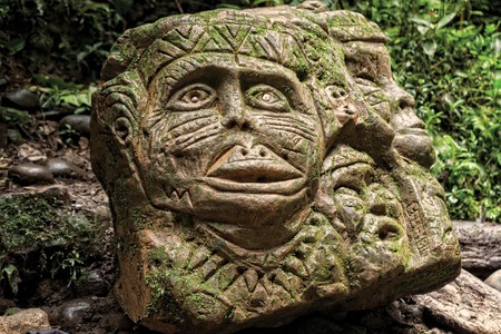 Ancient Pre Columbian Statue, Tropical Rainforest, South Americaの写真素材