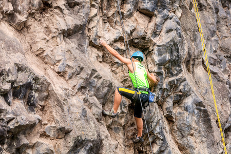 Basalt Challenge Of Tungurahua, Man Climbing Vertical Rock Wallの写真素材