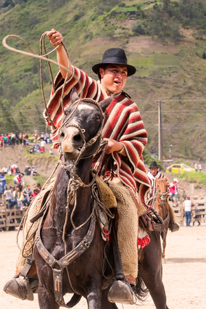 Banos, Ecuador - 30 November 2014: Portrait Of A Young Hispanic Cowboy Throwing A Lasso, South America Competition In Banos On November 30, 2014のeditorial素材