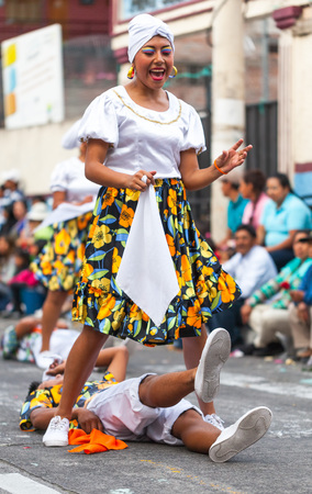Banos, Ecuador - 30 November 2014: Young Latin Couple Dressed In Traditional Costume Dancing In The Street  In Banos On November 30, 2014のeditorial素材