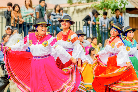 Banos De Agua Santa, Ecuador - 29 November 2014: Group Of Happy Adult Indigenous Women Dancing On City Streets Of Banos De Agua Santa, South America In Banos De Agua Santa On November 29,のeditorial素材