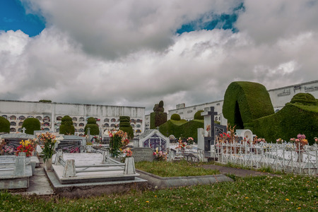 Tulcan, Ecuador- 10 Julio 2011: Tulcan Known For Its Elaborately Trimmed Cypress Bushes, Stringing graves,  In Tulcan, Ecuador On Julio 10, 2011のeditorial素材
