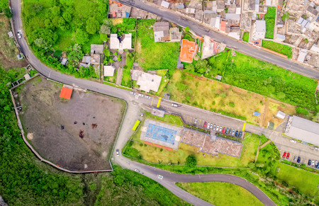 Aerial City View With Buildings And Parking Lots Of Banos De Agua Santa, Tungurahua Province, In The Daylight, South Americaの写真素材