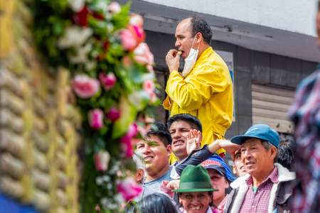 Banos De Agua Santa, Ecuador  - 29 November 2014: Group Of Hispanic People Waiting To Begin Annual Carnival On The Streets Of Banos De Agua Santa, South America, Christmas Holiday On November 29, 2014のeditorial素材