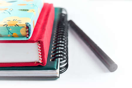 Close-up, stack of books isolated on whiteの写真素材