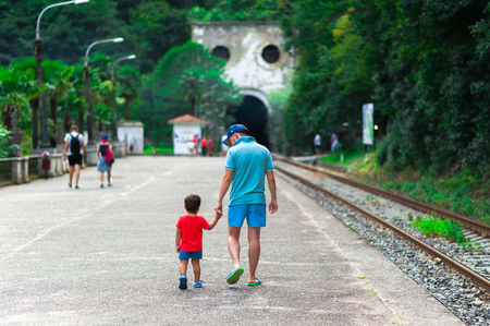 NEW ATHOS, ABKHAZIA. The abandoned railway station of Psyrtskha in New Athos. family. child. tourists. tour.のeditorial素材