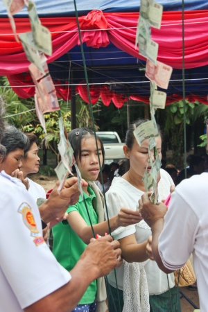 KALASIN, THAILAND - AUGUST 25  Do not know the name and number of people attending a religious ceremony on August 25, 2012 in Kalasin, Thailand のeditorial素材