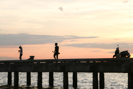 Jetty bridge was built as a cargo ship docks with fishing. Most fish are And seafood species A relaxing evening by Sourceの写真素材