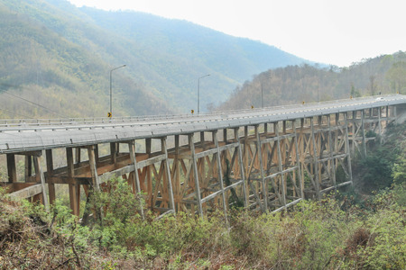 The bridge is a structure that connects the side for over a river valley in road, railway and water. The height of the bridge designの写真素材