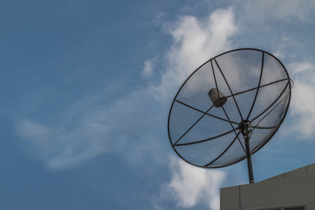 Satellite or satellite dish means. One antenna is specifically designed to fit the signal from the satellite. Floating in space and send signals back down to the ground slopeの写真素材
