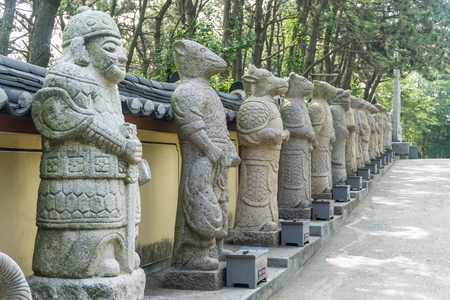 Animal god or mythology creature stone sculptures in Chinese culture. Text under each statues mean what animals are they.の写真素材