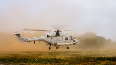 CHONBURI, THAILAND - FEB. 17, 2018: Super Lynx 300 multi-purpose helicopter of Royal Thai Navy lands on the ground during Cobra Gold 2018 Multinational Military Exercise on Feb. 17, 2018 in Chonburi.のeditorial素材