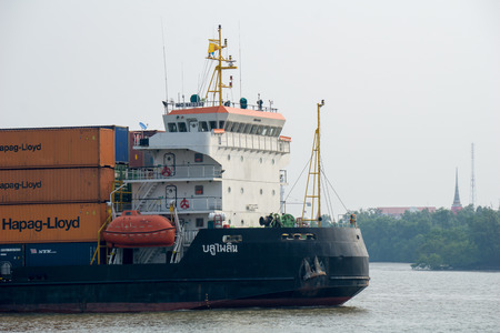 SAMUT PRAKAN - MARCH 24, 2018 : Cargos ship sails inbound to Chao Phraya river on March 24, 2018 in Samut Prakan province, Thailand.のeditorial素材