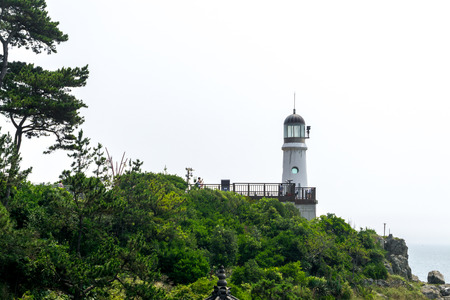 BUSAN,SOUTH KOREA - JULY 20, 2017: Old lighthouse on the hill of Haeundae Dongbaekseom Island on July 20, 2017 in Busan, South Korea.のeditorial素材
