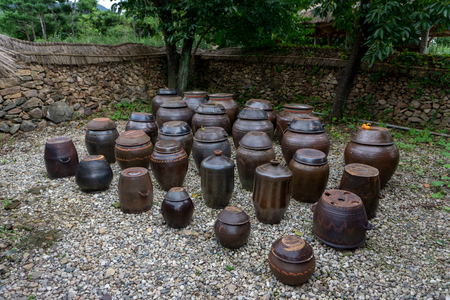 Vase of kimchi outside the house, Traditional Kimchi making in the Korea. Kimchi, a traditional and national food of Korean made with several vegetable mixed with chillies and preserved in the earthenware vesicle, pot or jar.のeditorial素材
