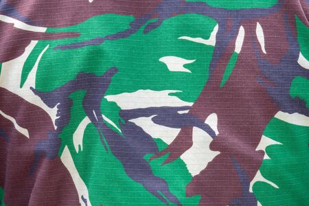 Indonesian marine camouflage uniform. Random ripple shape camouflage with green white black and brown coloursの写真素材