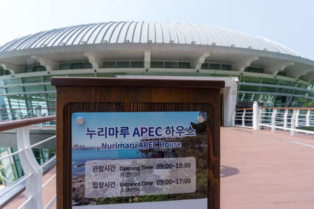BUSAN,SOUTH KOREA - JULY 20, 2017: Information plate of Nurimaru APEC House, the convention hall for 2015 APEC summit meeting locate on Haeundae Dongbaekseom Island.のeditorial素材