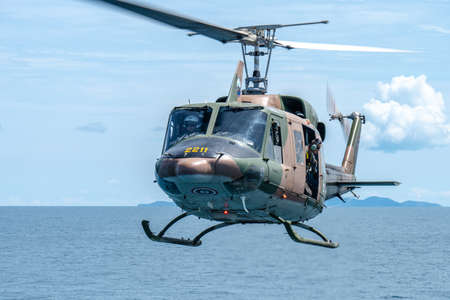CHONBURI, THAILAND - JULY 9, 2020: The Bell 212 helicopter of royal Thai navy fly over the sea near Sattahip naval base, Chonburi, Thailandのeditorial素材