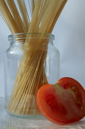 Spaghetti and red tomatoの写真素材