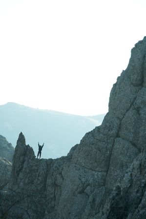 Joyful men on the rockの写真素材