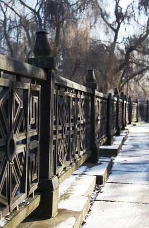 Snowcovered asphalt trail in the city parkの写真素材