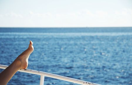 Pelaxing woman on the yacht in seaの写真素材