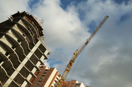 New building and crane on blue background