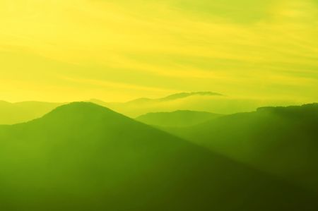 Peaceful pappy sunset in mountainの写真素材