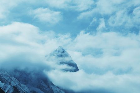 Peak in clouds in Himalayan