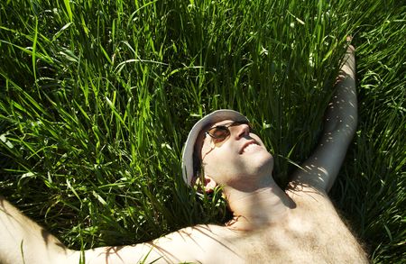 Relaxing man in the grassの写真素材