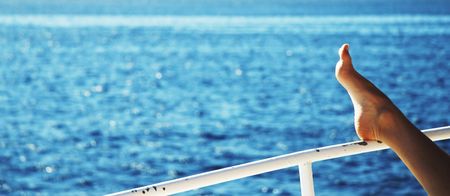 Pelaxing woman on the yacht in seaの写真素材