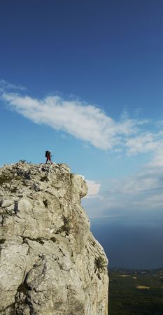 Men overview landscapes on the cliffの写真素材