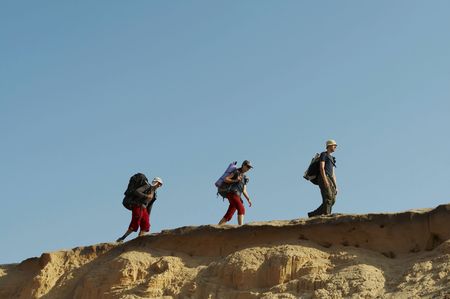 Group going  in sand desert